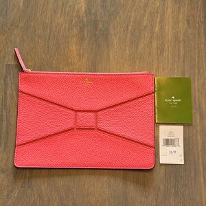 kate spade bridge place pebbled leather bow clutch in flamingo